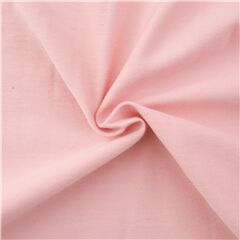 Peach pink solid cotton knit fabric by Robert Kaufman Petal